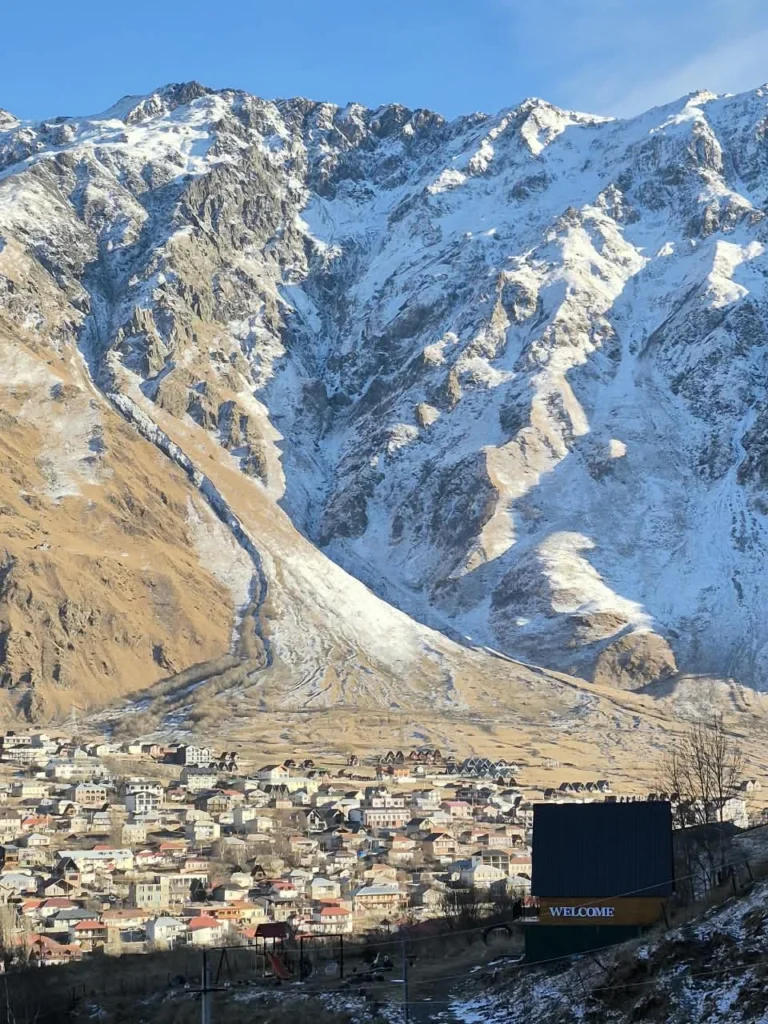 Stepantsminda and the mountains of Kazbegi, Georgia.