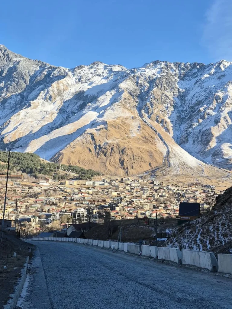 Stepantsminda and the mountains of Kazbegi, Georgia.