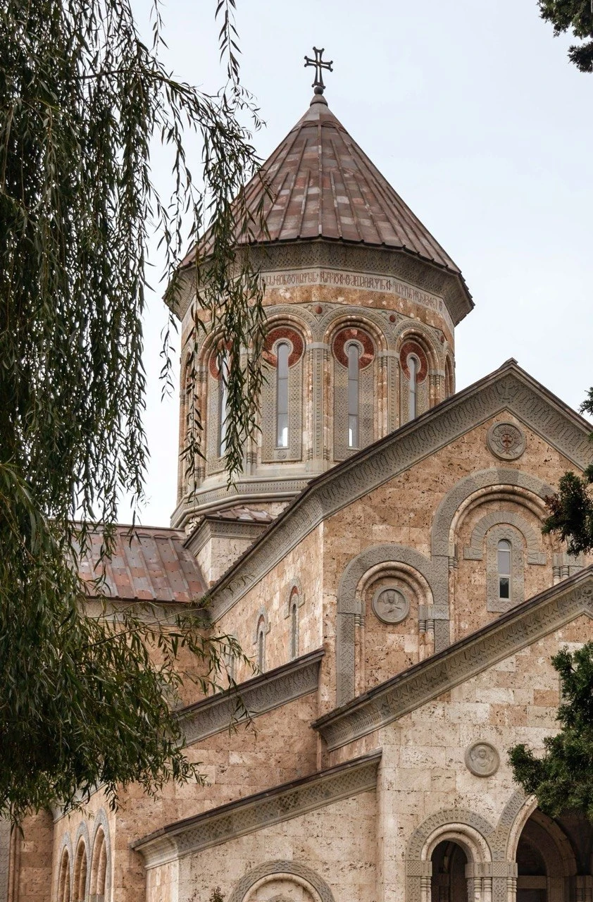 A church framed by trees in Kakheti, Georgia.