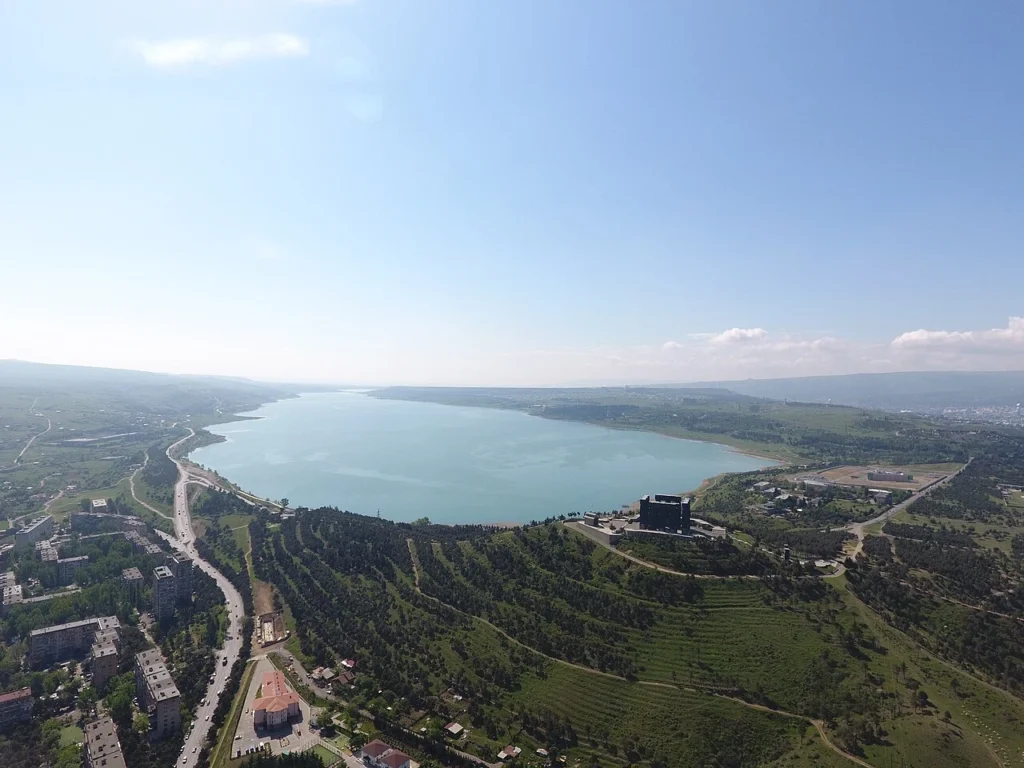 A panoramic view of Tbilisi Sea and its surrounding hills.